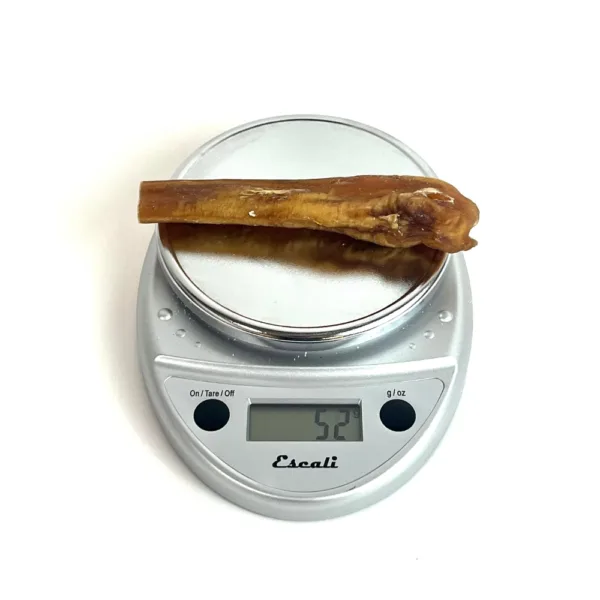 6" Extra Jumbo Mid-Grade Bully Sticks on a scale