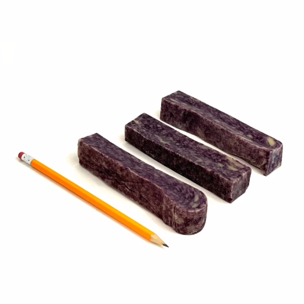 Blueberry Yak Chews next to a pencil for comparison