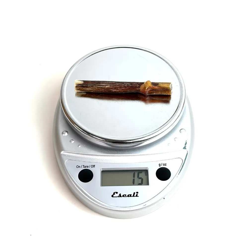 3"-5" Bully Sticks | Thin-Thick (~7-20g) | Low-Medium Odor 3 3"-5" straight bully sticks, thin-thick, low-medium odor, on a scale